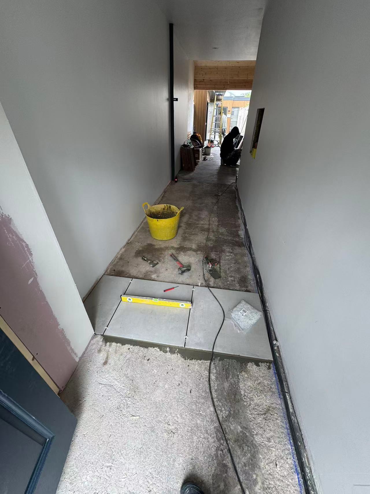 Hallway and ground floor porcelain tiling during full renovation — image 3