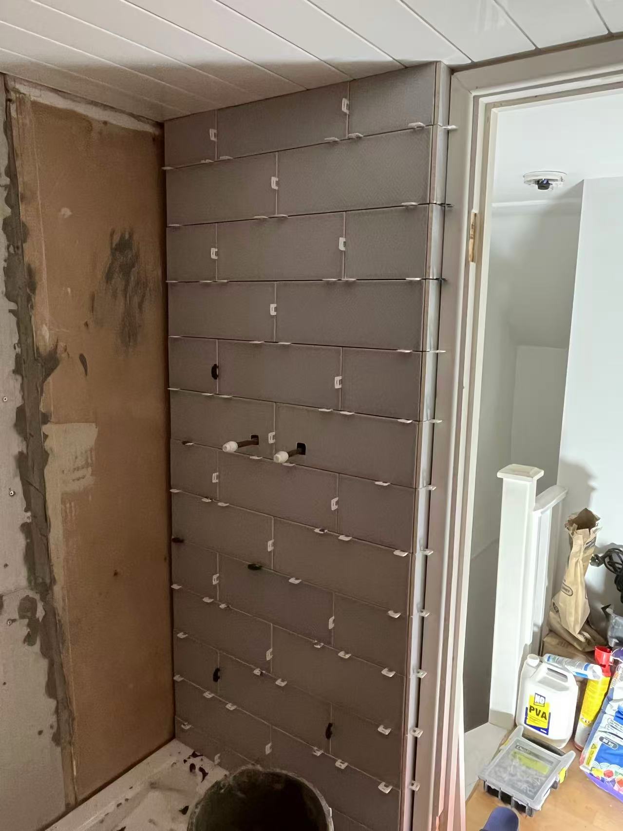 Full bathroom strip-out and retile in progress — image 2