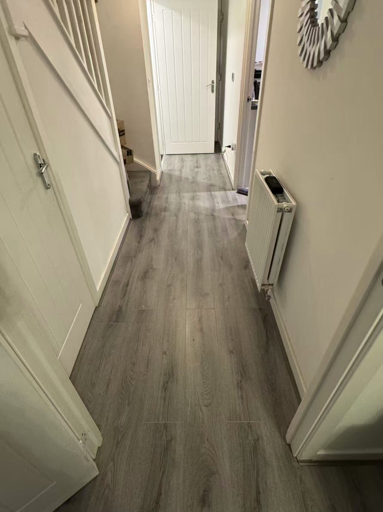 Whole-home laminate installation over a prepared subfloor — image 4