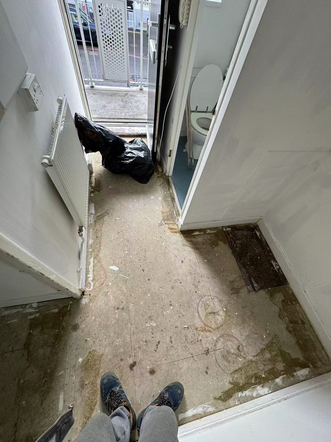 Hallway and reception laminate over a stripped concrete floor — image 3