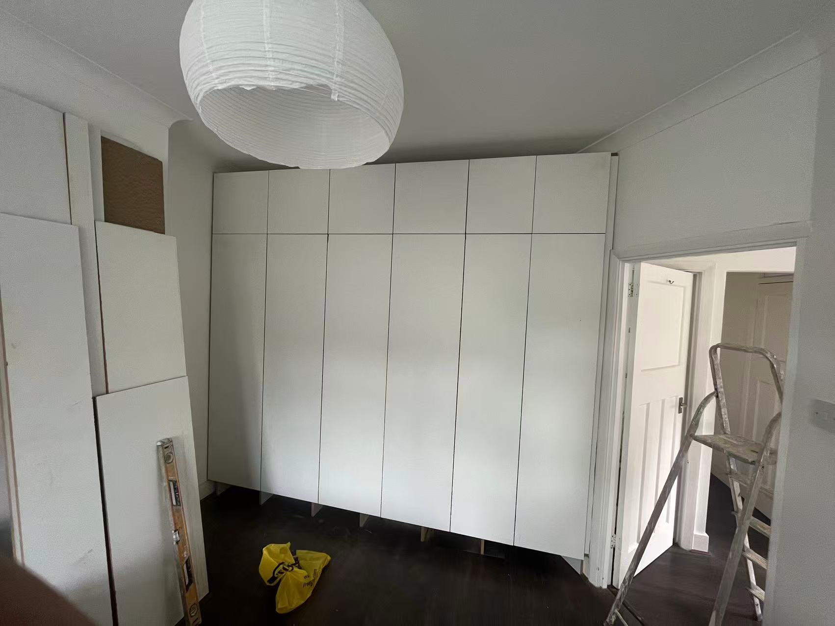 Painted fitted wardrobes with brushed steel handles — image 2