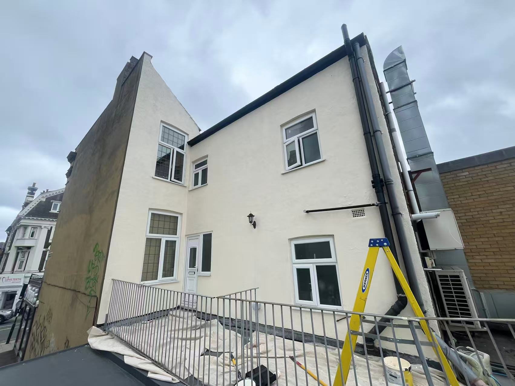 Exterior render repair and full repaint — image 3
