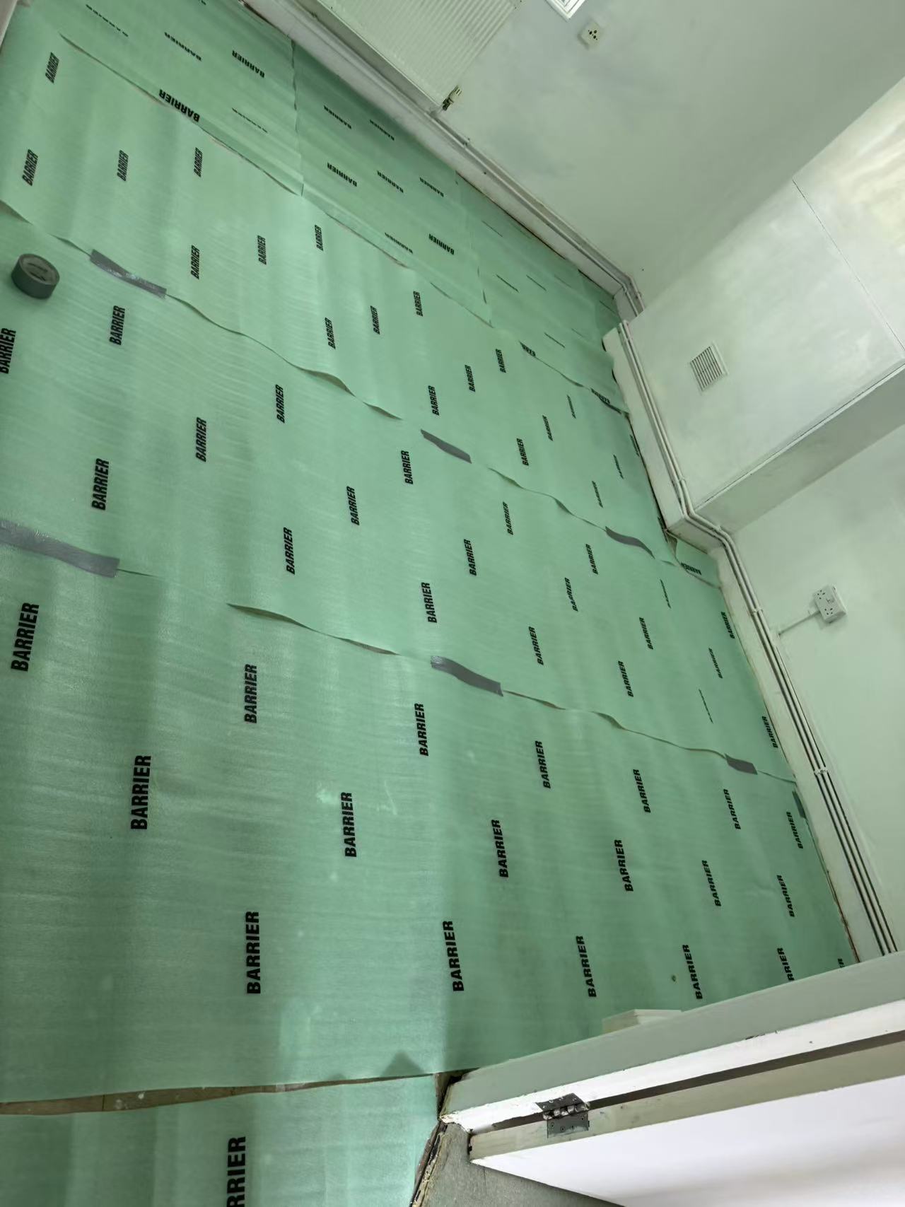 Hallway and reception laminate over a stripped concrete floor — image 5