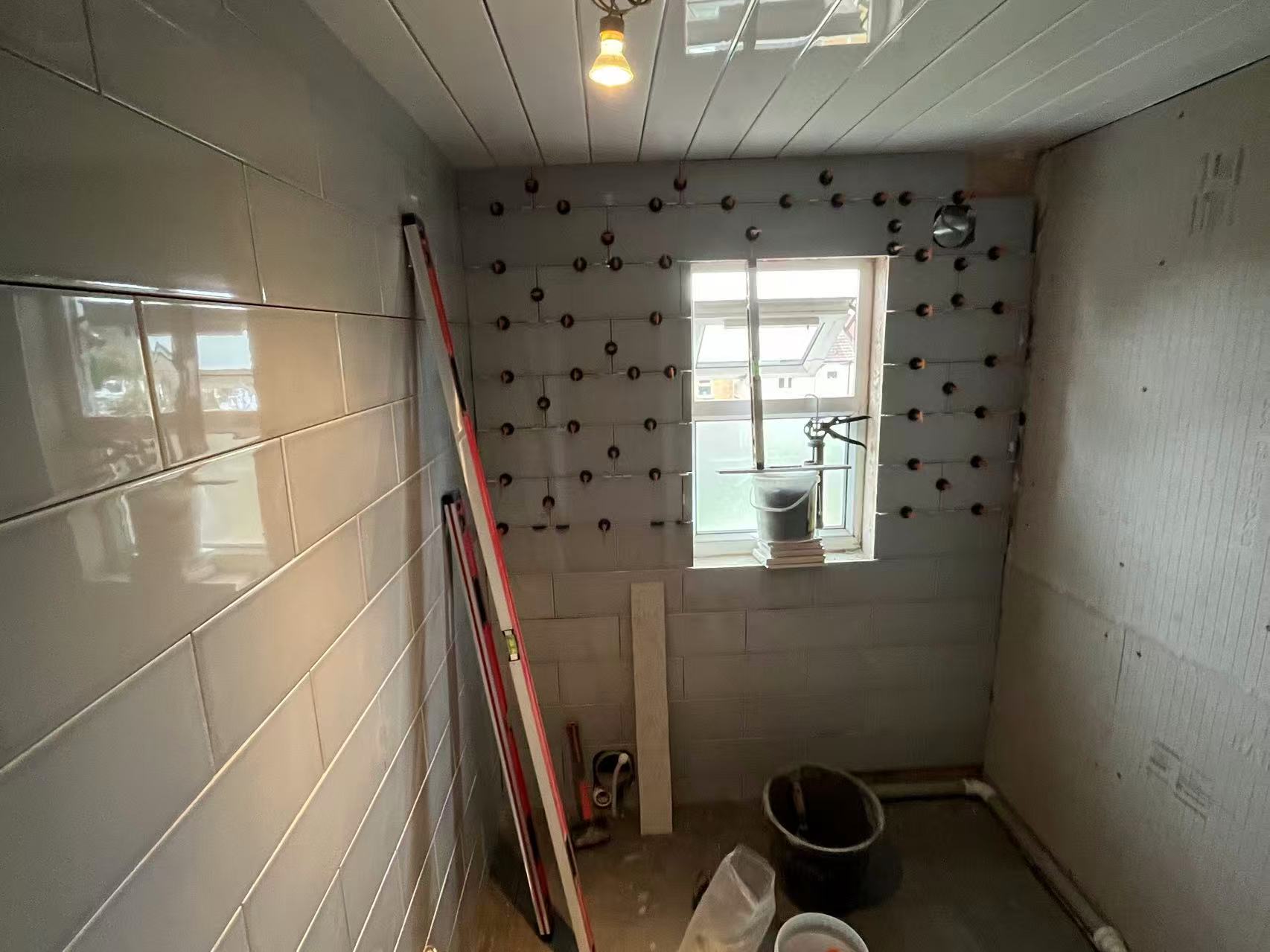 Full bathroom strip-out and retile in progress — image 3