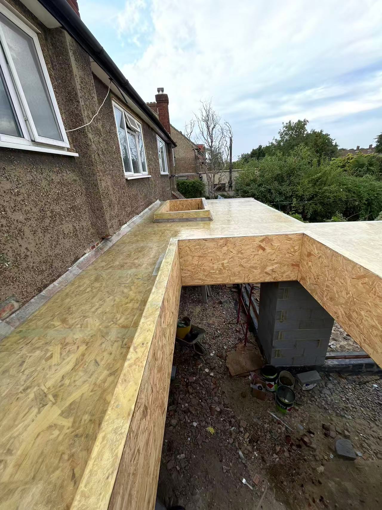 Wrap-around rear extension and garden room — image 1