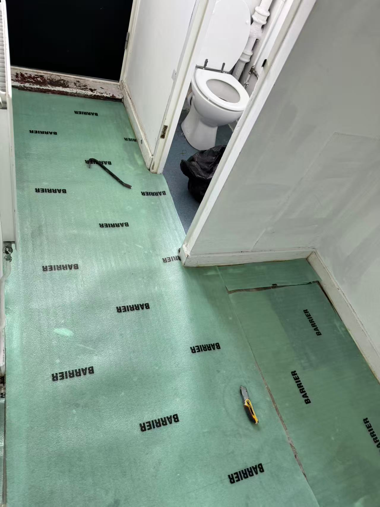 Hallway and reception laminate over a stripped concrete floor — image 6