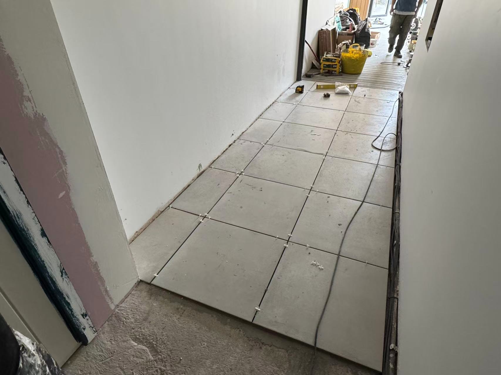 Hallway and ground floor porcelain tiling during full renovation — image 4