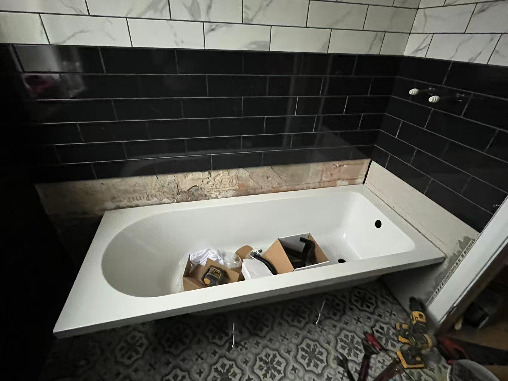 Monochrome bath surround with patterned floor — image 1