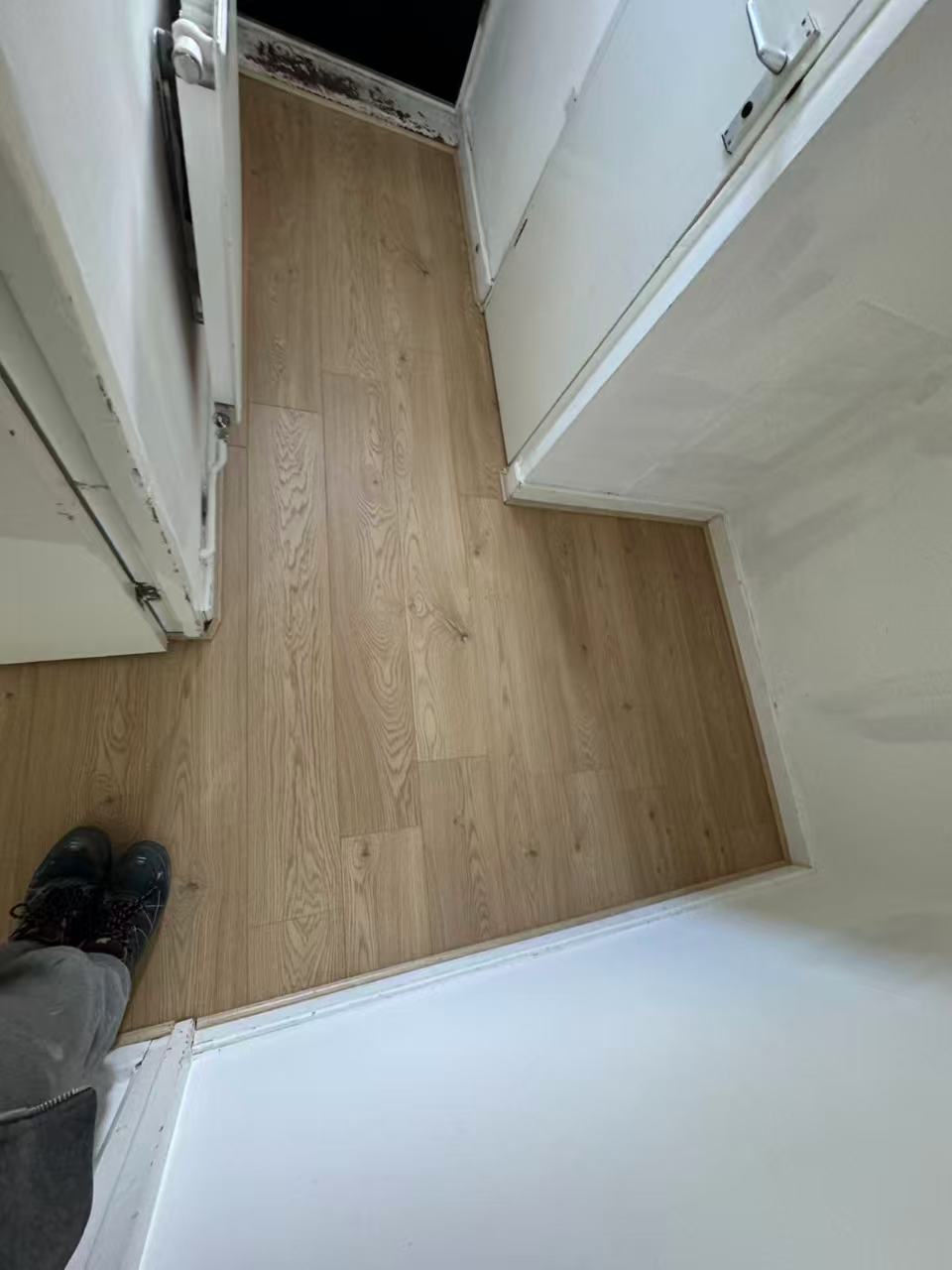Hallway and reception laminate over a stripped concrete floor — image 2