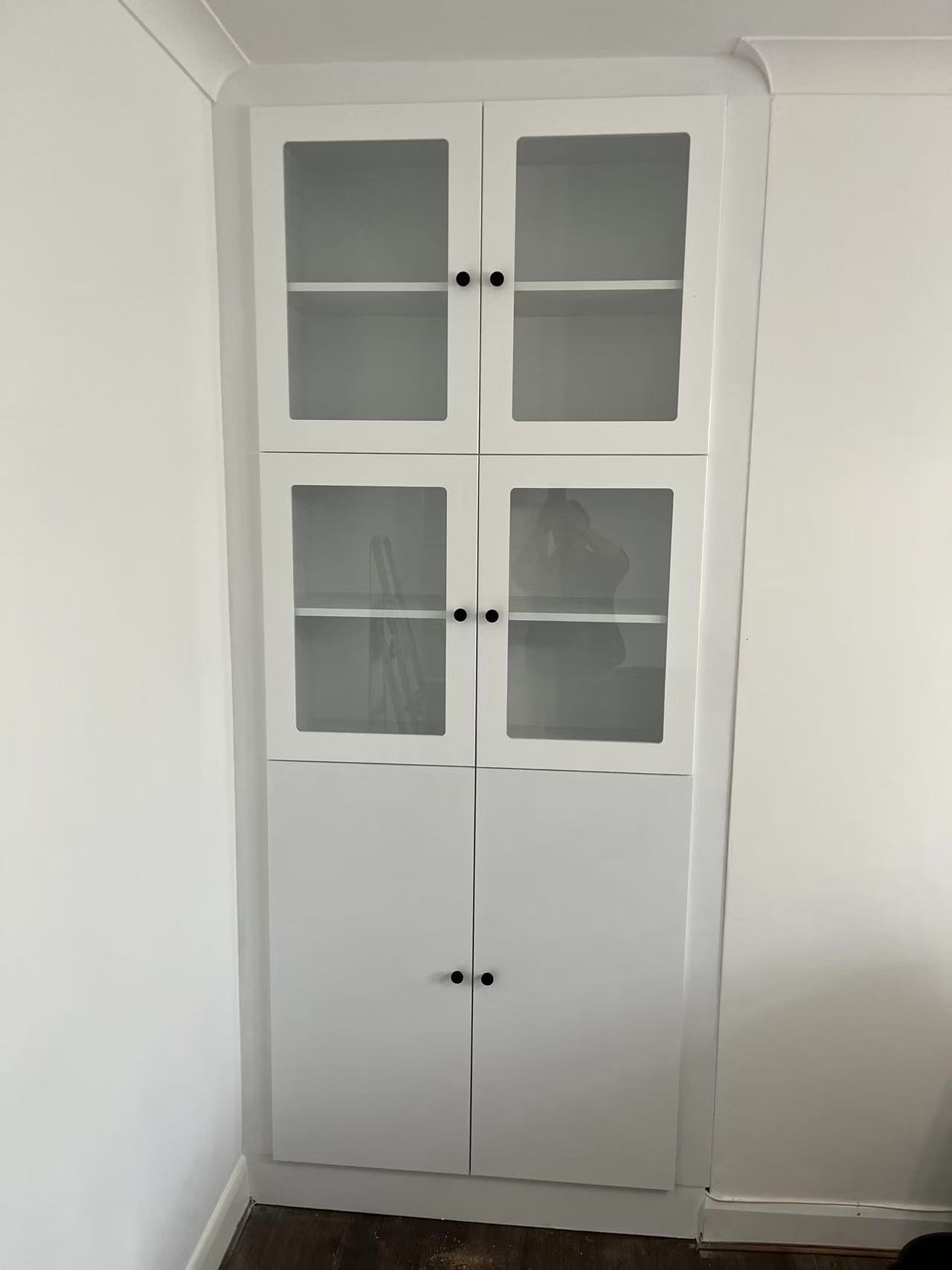 Painted glazed storage unit with black knob handles — image 1